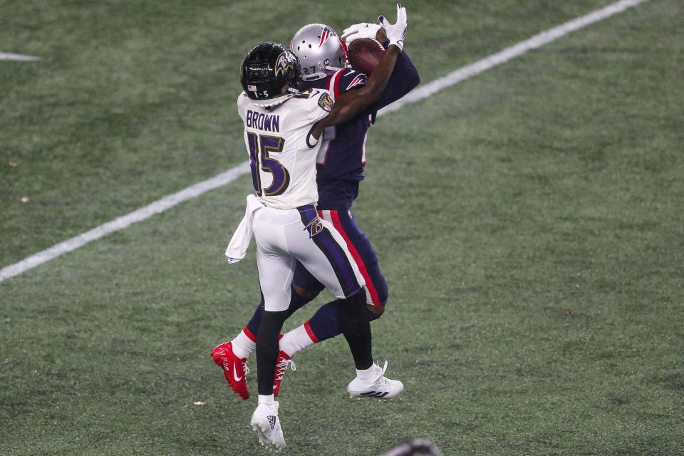 Patriots cornerback J.C. Jackson intercepts a pass during a game against the Baltimore Ravens in 2020.