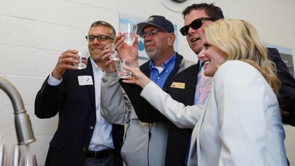 From left, city managers raise a toast Tuesday before drinking purified water from Pismo Beach’s new recycling facility: Matthew Bronson of Grover Beach; Jim Bergman of Arroyo Grande and Jim Lewis of Pismo Beach along with Arroyo Grande Councilwoman Kristen Barneich. Five Cities’ community leaders were in Pismo Beach for the ribbon-cutting and opening of Central Coast Blue, a new advanced water purification demonstration facility.