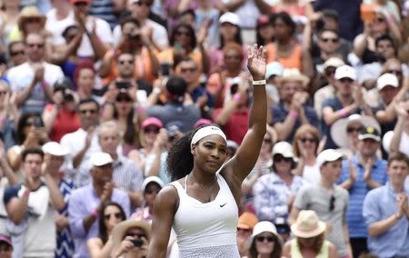 Serena Williams of the U.S.A. celebrates after winning her match against Venus Williams of the U.S.A. at the Wimbledon Tennis Championships in London, July 6, 2015. REUTERS/Toby Melville