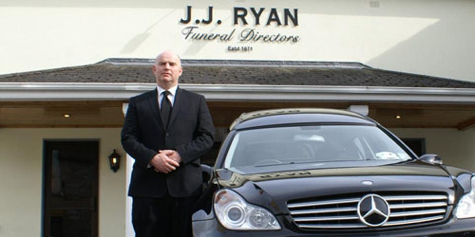 Mr Ryan with his hearse (Phillip Ryan)