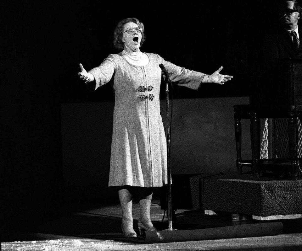 FILE - In this May 13, 1975, file photo, Kate Smith sings "God Bless America" before an NHL hockey Stanley Cup playoff game between the New York Islanders and the Philadelphia Flyers in Philadelphia. The New York Yankees have suspended the use of Smith's recording of "God Bless America" during the seventh-inning stretch while they investigate an allegation of racism against the singer. (AP Photo, File)