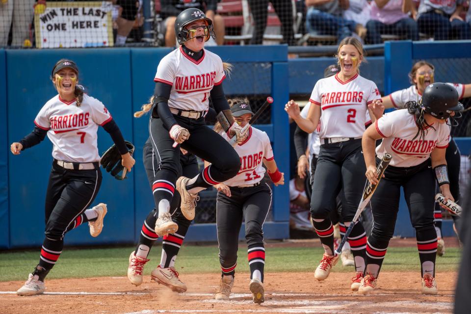 Washington players react during the Class 3A Fast Pitch Softball State Championship game against Tishomingo, Saturday, Oct. 8, 2022, at USA Softball Hall Of Fame Stadium in Oklahoma City.