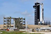 New construction surrounds the SpaceX Crew Dragon capsule atop a Falcon 9 booster rocket on historic Pad 39A at Kennedy Space Center at Cape Canaveral