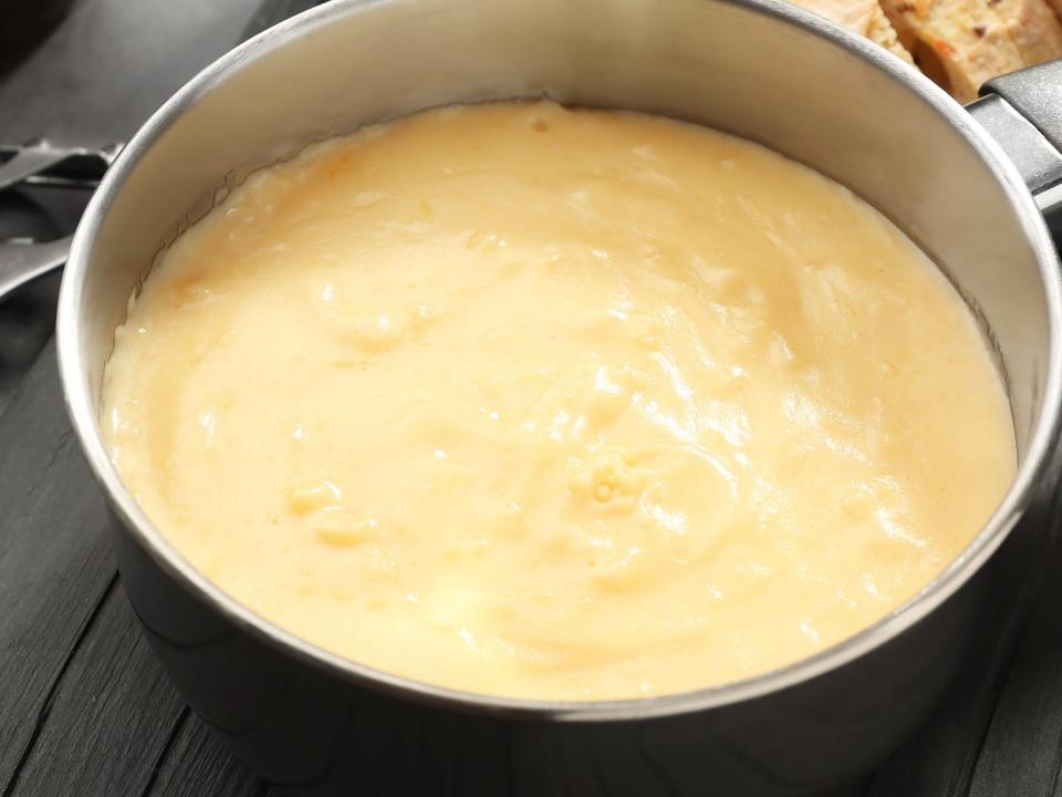 Beer cheese dip in a sauce pan