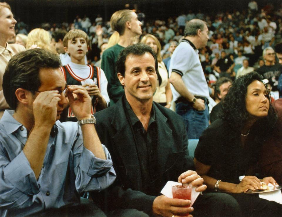 Sylvester Stallone watches a Miami Heat game at the arena in Miami in 1997, the same year he put his Miami home on Biscayne Bay on the market, eventually selling it in 1999. In December 2020, the "Rocky" star paid a recorded $35.38 million for a lakefront house in Palm Beach, sources confirmed for the Palm Beach Daily News.