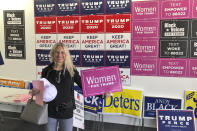 Yana Duke, a suburban voter in the Cincinnati area, turned out for a rally at a Trump-Pence campaign office on the first day of early voting in Ohio, on Tuesday, Oct. 6, 2020. The Donald Trump supporter says this is the first time she's been an active volunteer in a presidential campaign. (AP Photo/Dan Sewell)