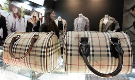 A real Burberry bag and its counterfeit copy are displayed during the Counterfeit Comparison Exhibition 2009 organised by the KCS in Seoul