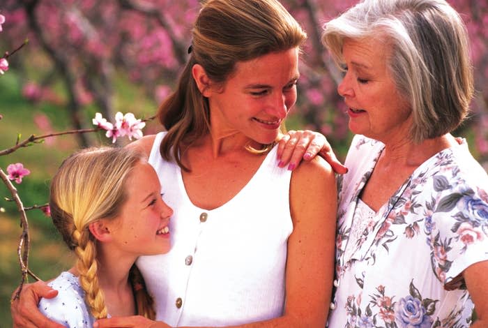 mother, daughter, and grandmother posing for a photo together in the 1990s