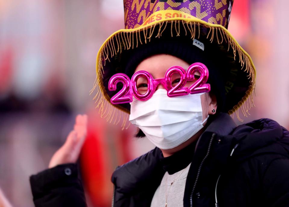 Jumi Kim of New York City was among thousands of New Year's Eve revelers who filled Times Square in Manhattan during New Year's festivities Dec. 31, 2021. Due to the Covid-19 pandemic and the recent wave of Omicron infections, the number of people allowed in Times Square was lowered from the usual 60,000 to 15,000. All who attended had to show proof of full vaccination status. 