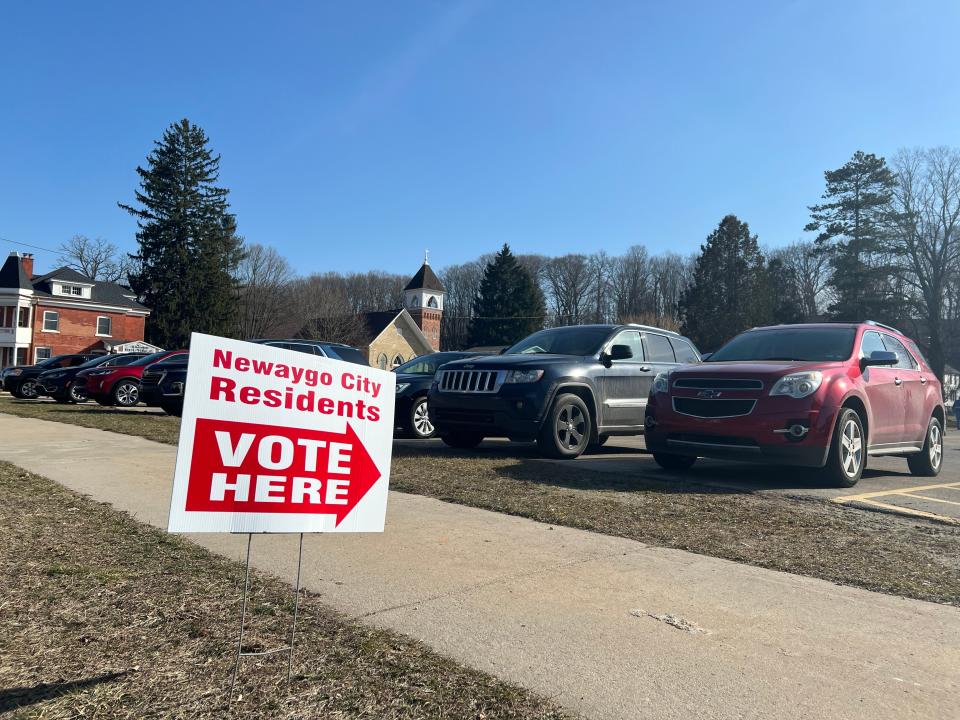 A "vote here" sign is posted outside Newaygo city hall on Tuesday, Feb. 27, 2024, in Newaygo, Mich.