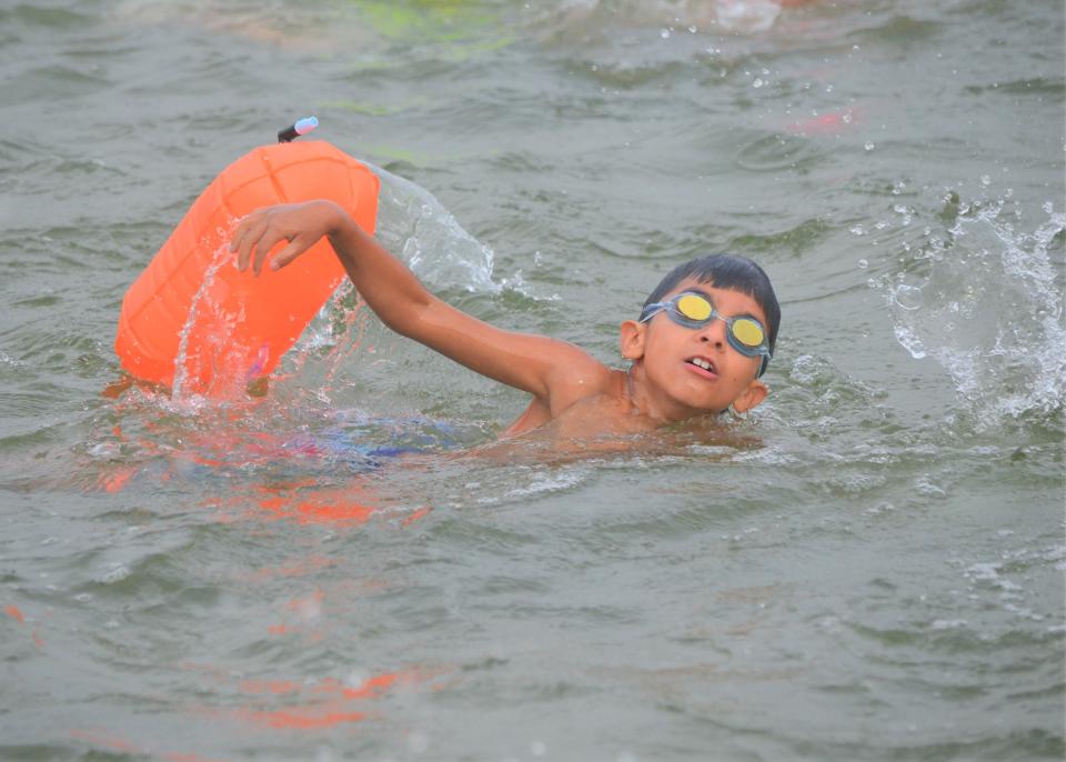 Battle Creek's Aaron Felix, 8, competes in the 95th annual Goguac Lake Swim on Saturday.