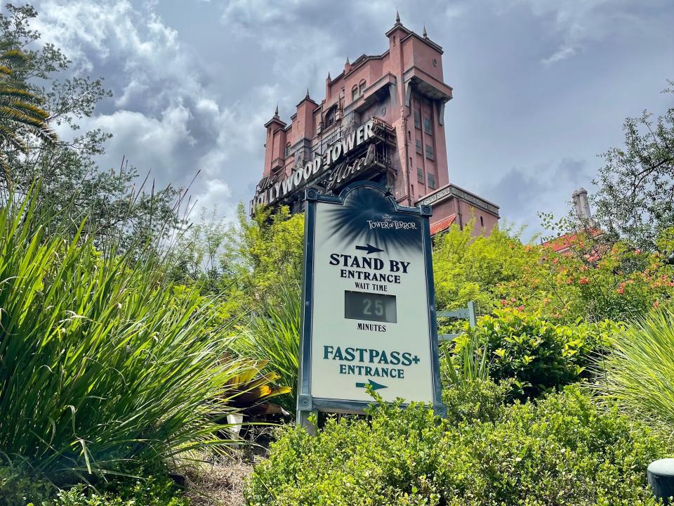 exterior shot of wait time board in front of tower of terror hollywood studios