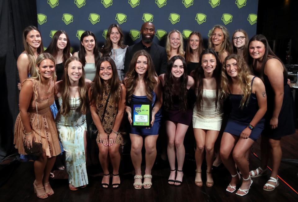 The New Albany girls lacrosse team poses for a photo with former Ohio State and NFL player Malcolm Jenkins at the Central Ohio High School Sports Awards on June 15 at the Ohio Theatre. The Eagles earned Team of the Year honors for winning the Division I state championship. Jenkins was the guest speaker at the show.