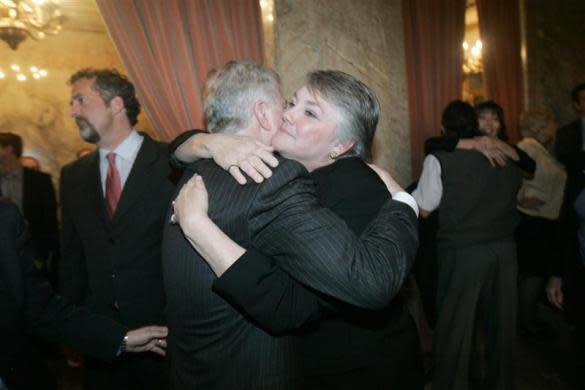 Washington State Senator Ed Murray (L) is congratulated by Republican Rep. Maureen Walsh after the State House of Representatives passed a bill endorsing gay marriage in the state, in Olympia February 8, 2012. Walsh was a co-sponsor of the bill.