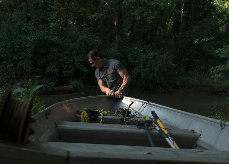 Brian Zoeller pulls his boat down to Buck Creek on Wednesday, Sept. 14, 2022, near Acton, Ind. 