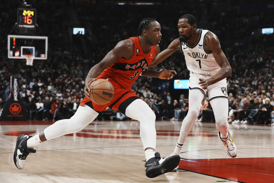 Toronto Raptors forward O.G. Anunoby (3) drives against Brooklyn Nets forward Kevin Durant (7) during the first half of an NBA basketball game Wednesday, Nov. 23, 2022, in Toronto. (Chris Young/The Canadian Press via AP)