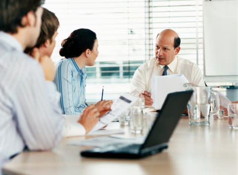 CEO Talking to a Business Executive in a Boardroom Meeting