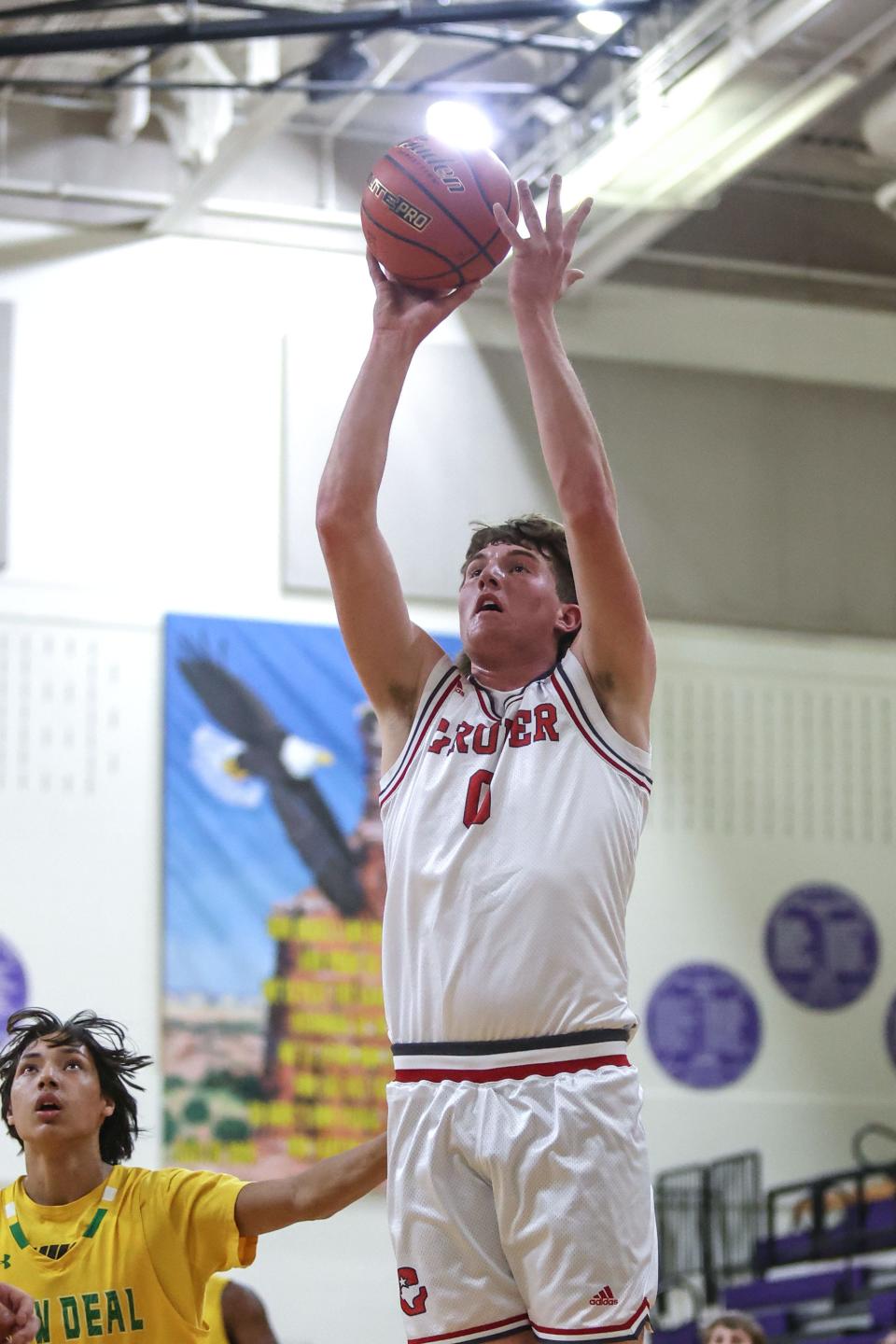 Gruver’s Jefferson Weaver (0) shoots the ball in a 2A Regional quarterfinal game against New Deal, Tuesday night, February 28, 2023, at Canyon High School in Canyon, Tx. New Deal won 51-48.