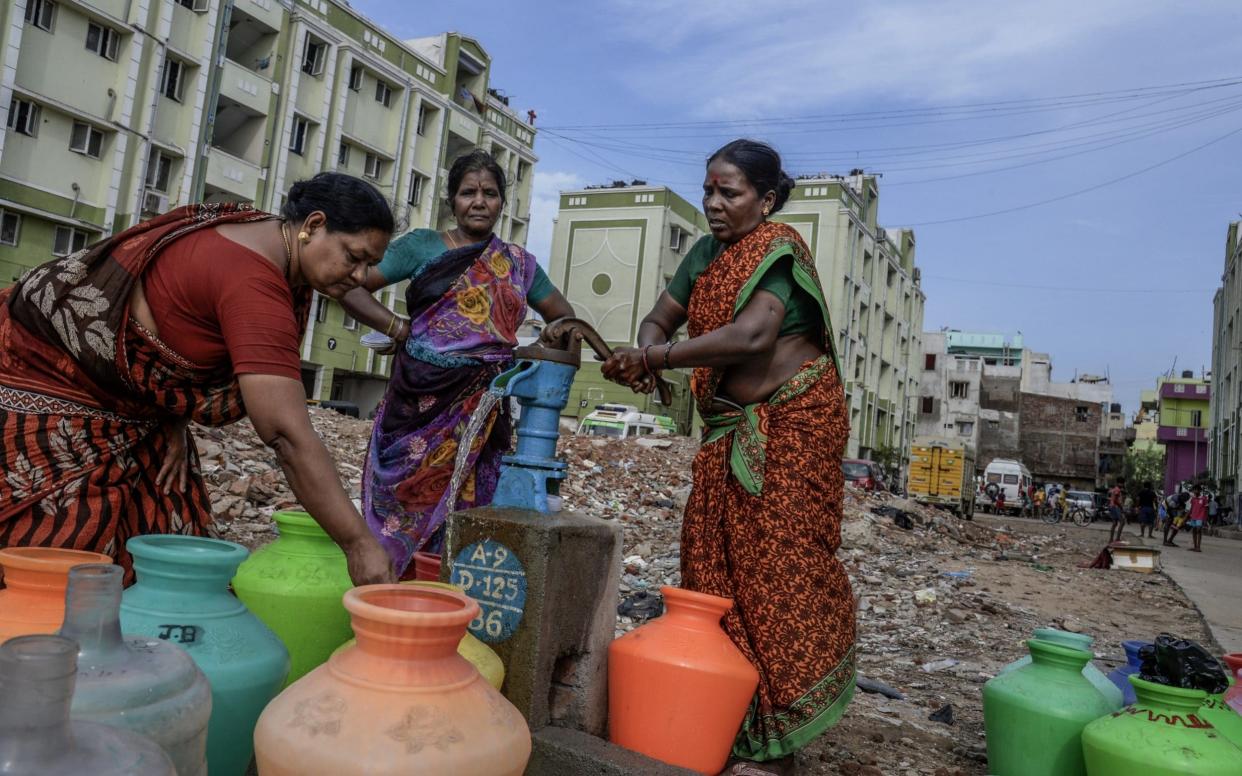 Women fill bottles during a drought in Chennai, India - Getty Images AsiaPac