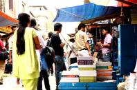 Students buy books on College Street.