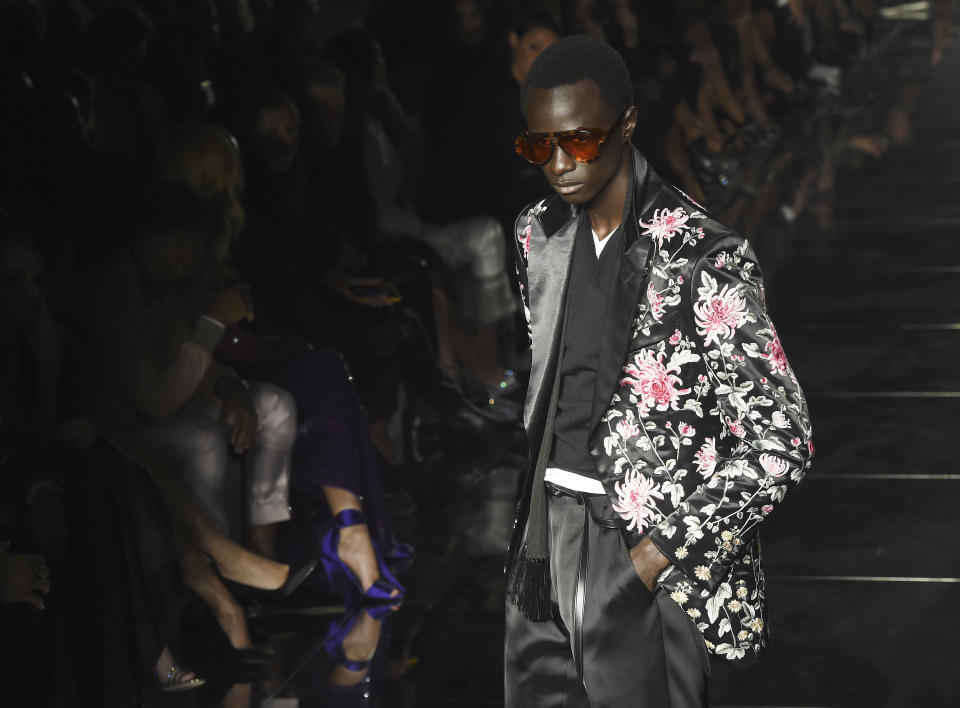 A model poses on the runway at the NYFW Fall/Winter 2020 - Tom Ford fashion show at Milk Studios, Friday, Feb. 7, 2020, in Los Angeles. (AP Photo/Chris Pizzello)