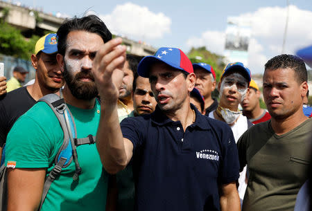 Opposition leader Henrique Capriles (C) gestures during a rally in Caracas, Venezuela, April 8, 2017. REUTERS/Carlos Garcia Rawlins