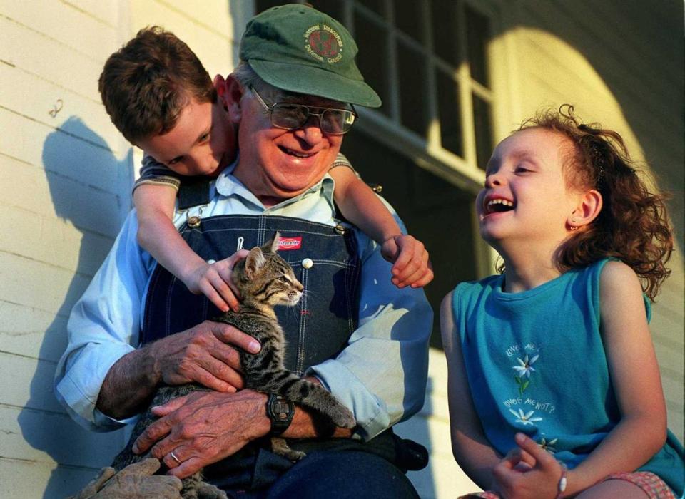 Cruz Reynoso, who was the first Latino to be elected to the California Supreme Court, plays with grandchildren Kyle, and Eden Reynoso outside his home in Herald in 2000. The giant of civil rights law who was the first Latino justice of the California Supreme Court, died Friday, May 7, 2021, at the age of 90.