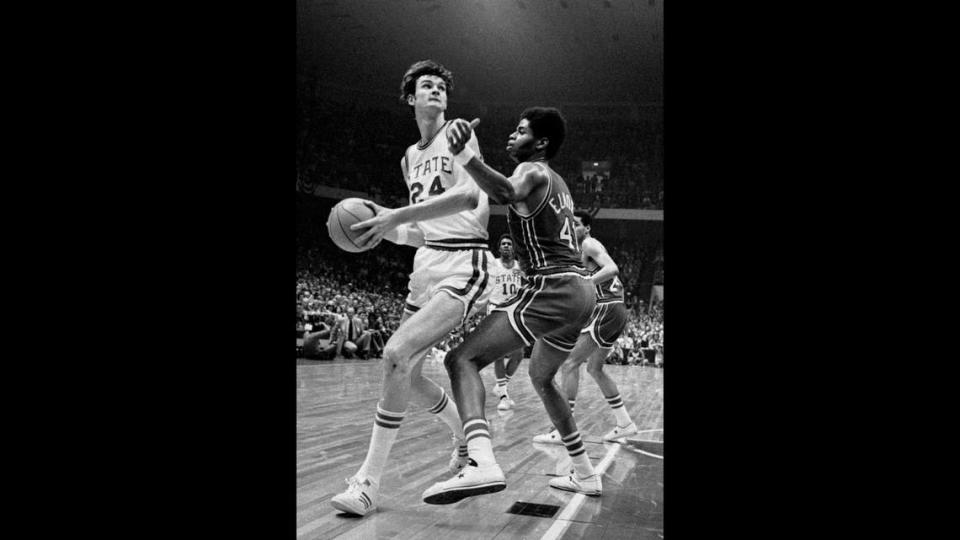 NC State’s Tommy Burleson drives against Maryland center Len Elmore in the 1974 ACC tournament championship game. Burleson scored 38 points and had 13 rebounds in the game.
