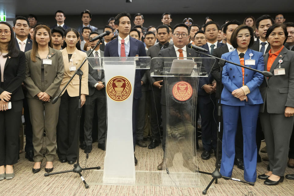 Move Forward party's leader Chaithawat Tulathon, center right, with its former leader Pita Limjaroenrat, center left, talks to reporters during a news conference at parliament in Bangkok, Thailand, Wednesday, Jan. 31, 2024. Thailand’s Constitutional Court ruled Wednesday that the progressive Move Forward party must cease advocating amending the law on royal defamation — a decision that leaves the party vulnerable to further complaints and even dissolution. (AP Photo/Sakchai Lalit)