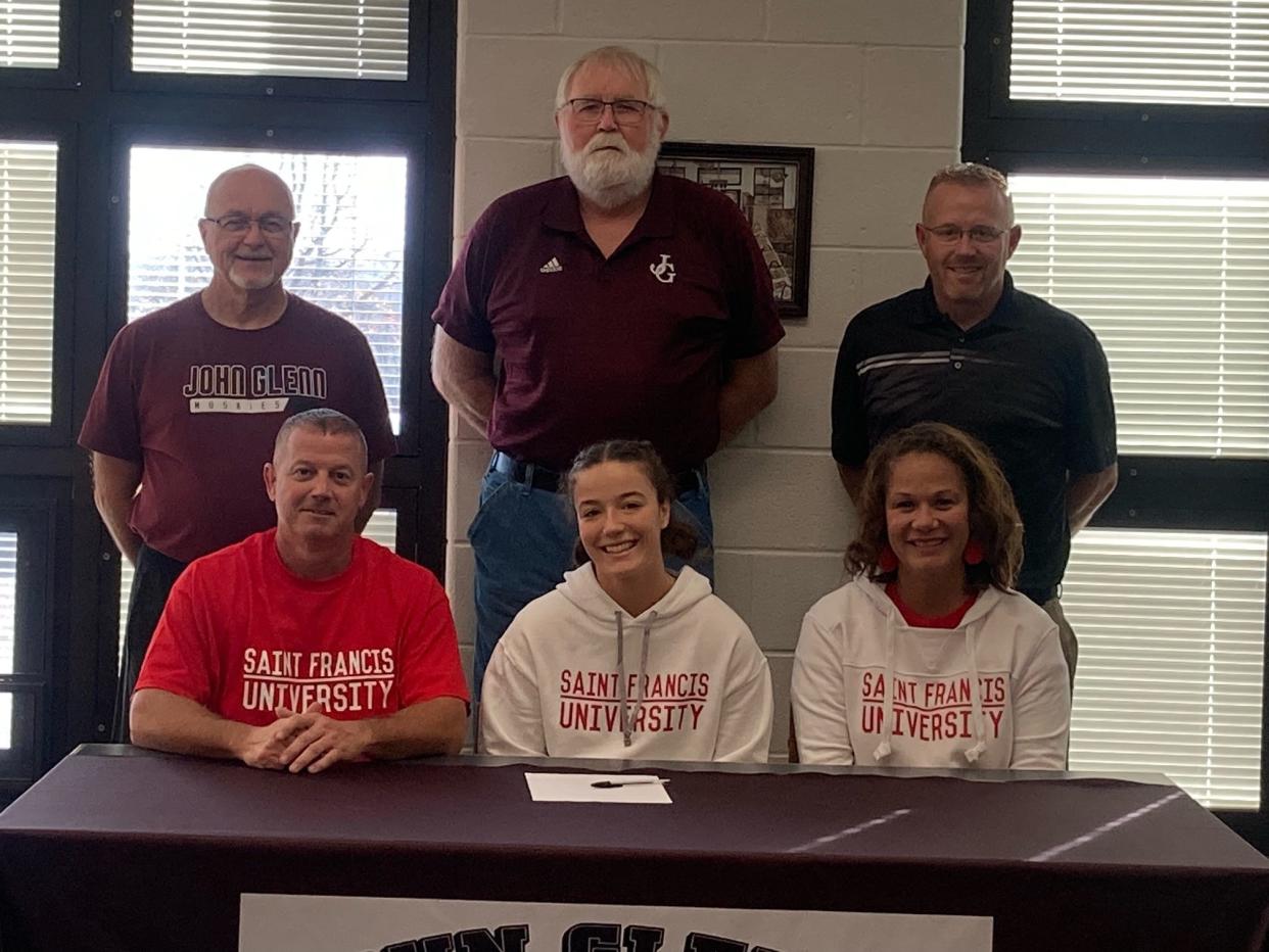 John Glenn senior Hannah Bendle signed her Letter of Intent on Thursday afternoon to attend St. Francis University to continue both her academic and softball careers. Seated: Mitch Bendle, Hannah Bendle, Summer Bendle. Standing: John Glenn softball coaches, Steve Cowgill, Randy Larrick, Kyle Porter