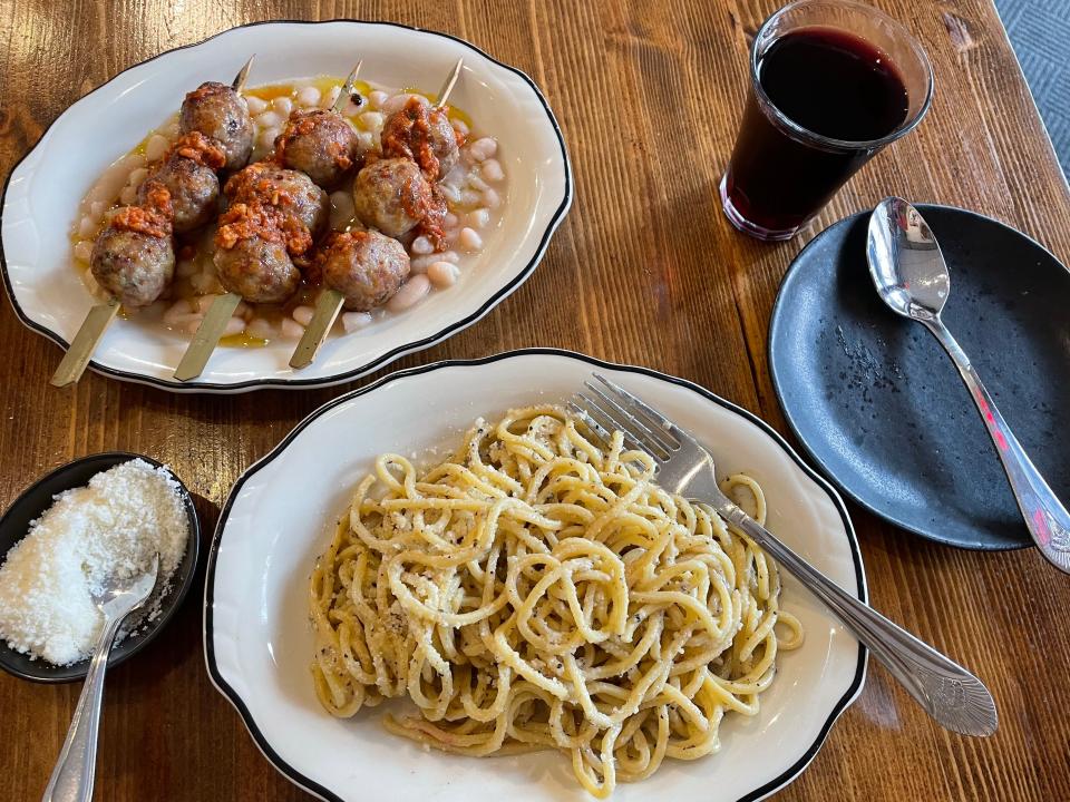 Spaghetti alla Chitarra and Meatball Spiedini (Heritage pork meatballs served with cranberry beans and Sicilian pesto) at DPNB Pasta & Provisions in Nyack. Photographed June 23, 2023