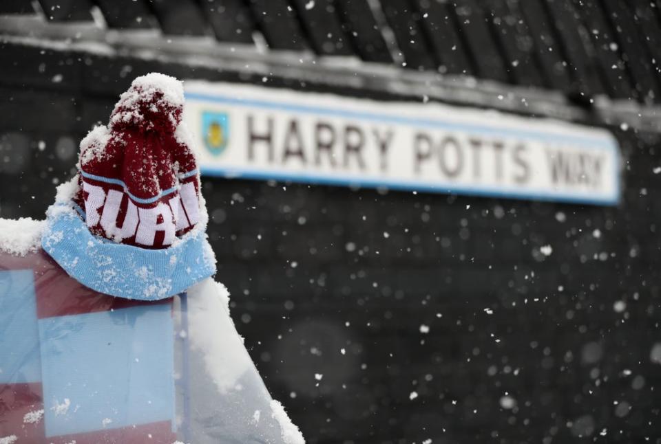 Snow fell on Harry Potts Way outside Turf Moor, named after the club’s title-winning former manager (Bradley Collyer/PA) (PA Wire)