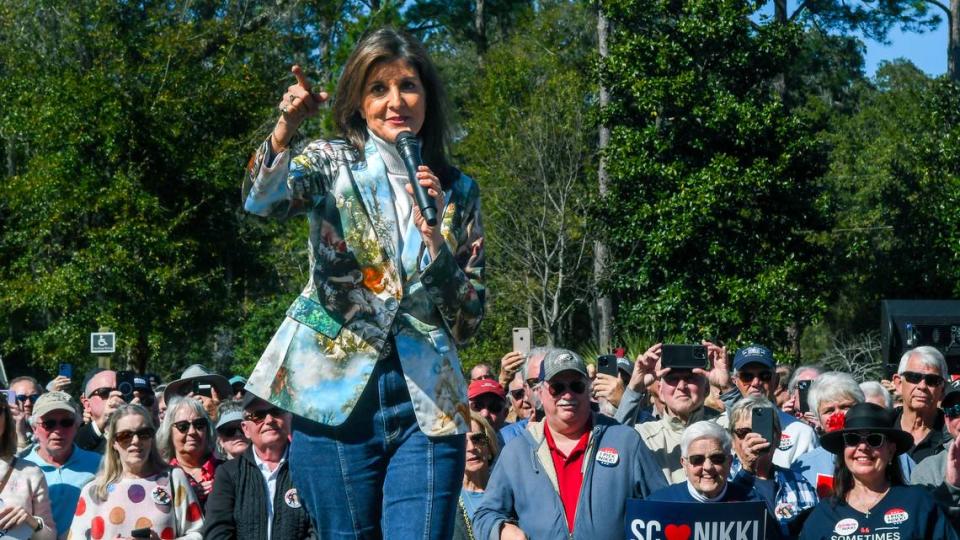 Former S.C. Governor and U.S. Ambassador to the United Nations Nikki Haley turns and thanks 14th Circuit Solicitor Duffie Stone for introducing her at her political bus tour stop on Tuesday, Feb. 13, 2024 as she campaigned for the GOP presidential nominee at Bluffton Oyster Factory Park in Old Town Bluffton.