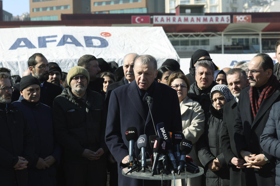 FILE - Turkey's President Recep Tayyip Erdogan speaks to the media as he visits the city center destroyed by Monday earthquake in Kahramanmaras, southern Turkey, Wednesday, Feb. 8, 2023. Turkish President Recep Tayyip Erdogan came to power 20 years ago riding a wave of public outrage toward the previous government's handling of a deadly earthquake. Now, three months away from an election, Erdogan's political future hinges on how the public perceives his government's response to a similarly devastating natural disaster. (Turkish Presidency via AP, File)