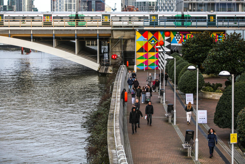 <p>People walk alongside the River Thames in London, as the UK continues in a third lockdown due to the Covid-19 pandemic. Picture date: Tuesday February 16, 2021.</p>
