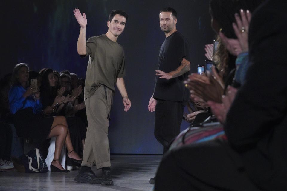 Proenza Schouler designers Lazaro Hernandez, left, and Jack McCollough appear on runway after the showing of their Spring Summer 2023 collection is modeled during Fashion Week, Friday Sept. 9, 2022 in New York. (AP Photo/Bebeto Matthews)