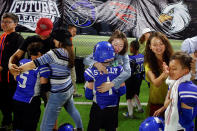 <p>Adults console players of the Sharklets after they lost to the Eagles in their Future League American football youth league match in Beijing, May 26, 2017. (Photo: Thomas Peter/Reuters) </p>