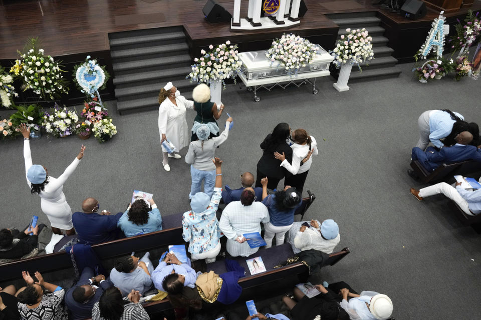 Mourners attend the funeral for Michigan State University shooting victim Arielle Anderson in Detroit, Tuesday, Feb. 21, 2023. Anderson, Alexandria Verner and Brian Fraser and were killed and several other students injured after a gunman opened fire on the campus of Michigan State University. (AP Photo/Paul Sancya)