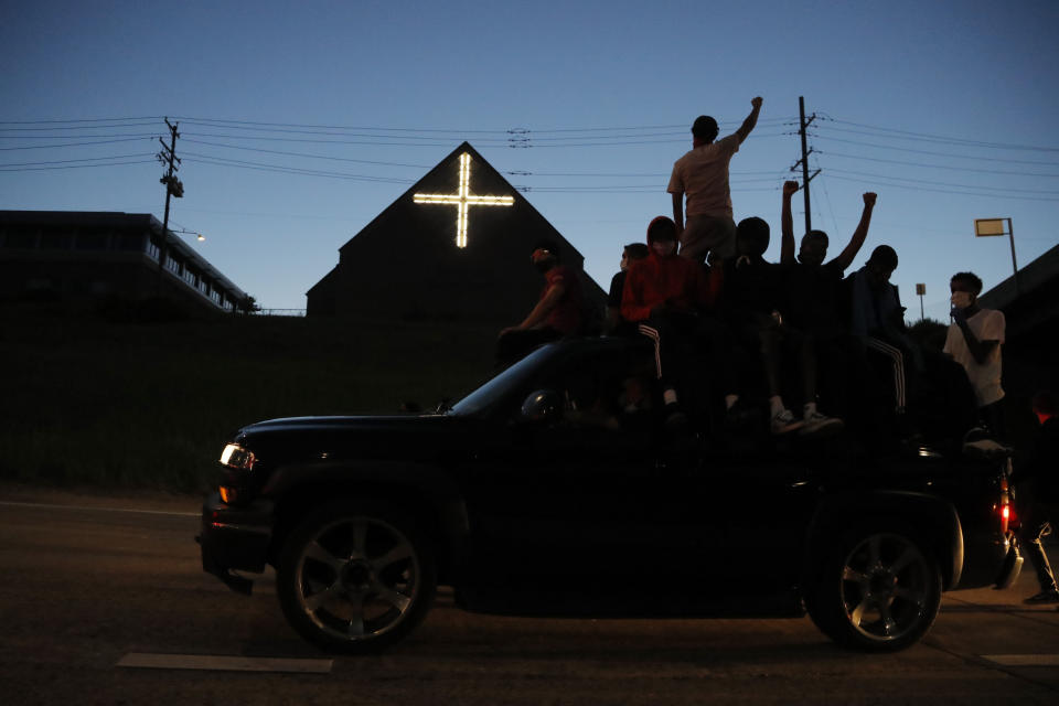 Protesters move along a highway, Friday, May 29, 2020, in Minneapolis. Protests continued following the death of George Floyd, who died after being restrained by Minneapolis police officers on Memorial Day. (AP Photo/Julio Cortez)