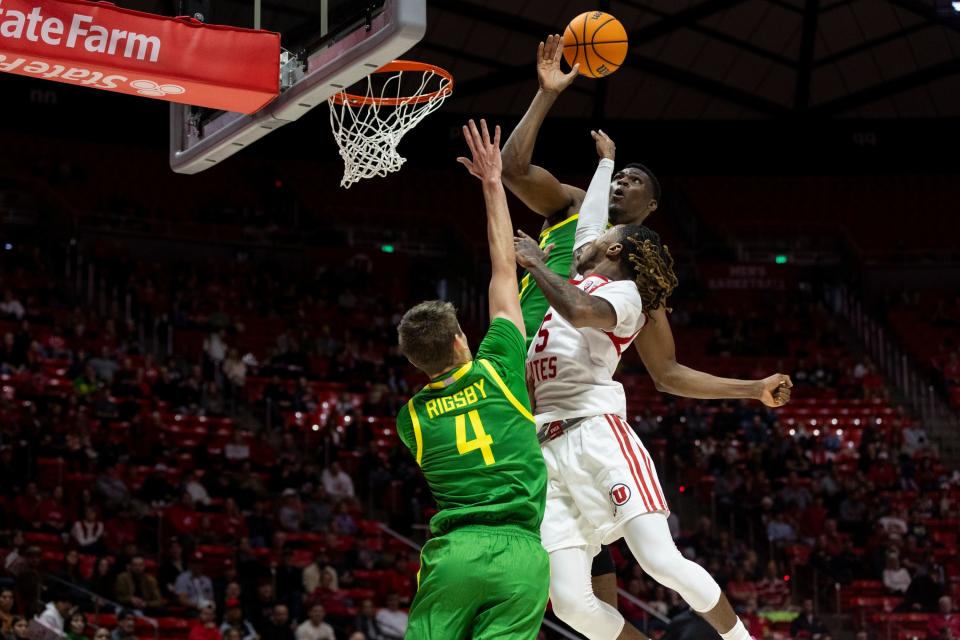 Utah Utes guard Deivon Smith (5) attempts a basket and is blocked by Oregon Ducks guard Brennan Rigsby (4) and center N’Faly Dante (1) at the Huntsman Center in Salt Lake City on Jan. 21, 2024. The Utes won 80-77. | Marielle Scott, Deseret News