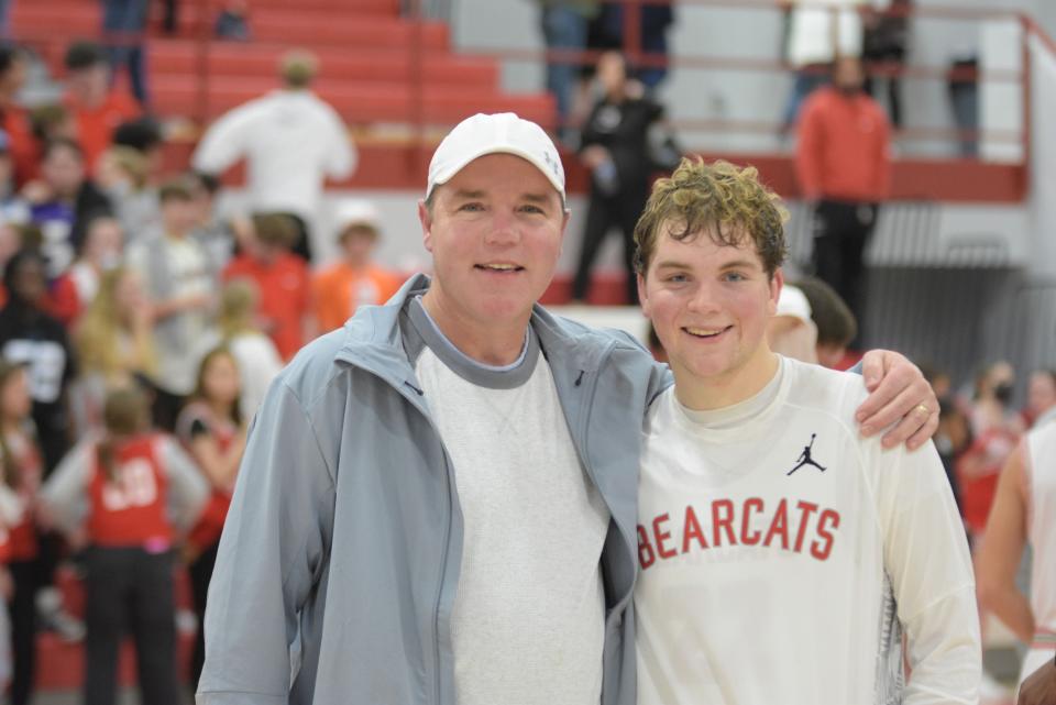 Bobby Britt, left, poses with his son, Jimmy, after a recent basketball game at Hendersonville.