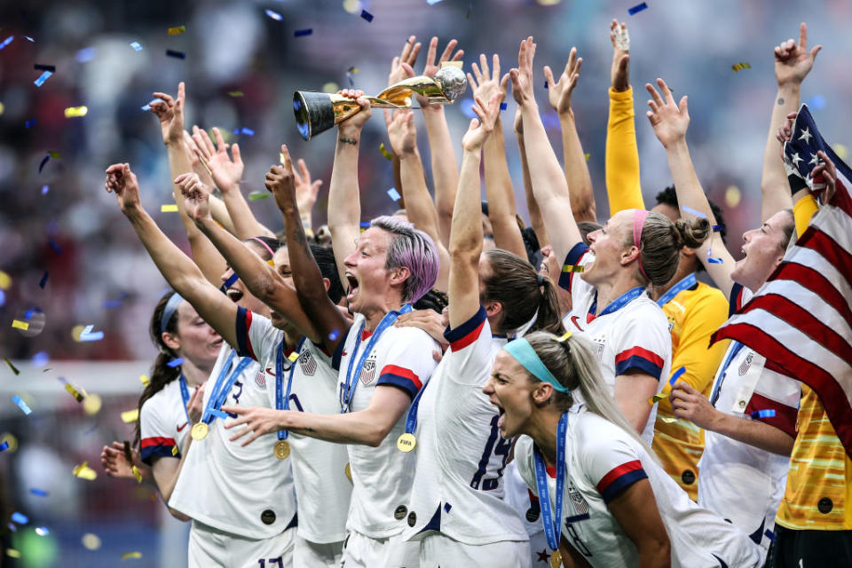 Megan Rapinoe of the USA lifts the FIFA Women's World Cup Trophy following her team's victory in the 2019 FIFA Women's World Cup France Final match between The United States of America and The Netherlands at Stade de Lyon on July 07, 2019 in Lyon, France. | Alex Grimm—Getty Images