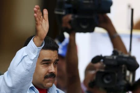 Venezuela's President Nicolas Maduro waves during a rally against the opposition's amnesty law at Miraflores Palace in Caracas April 7, 2016. REUTERS/Carlos Garcia Rawlins