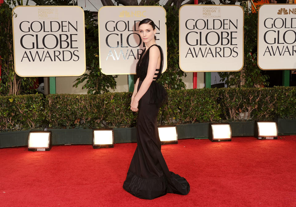 WORST: Recently a fashion favorite, Rooney Mara misses the mark on the red carpet. The modern cutouts of the dress combined its old-fashioned black bustle leave us confused.