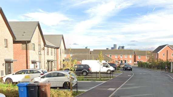 Children walk down residential Jane Street in Weaste