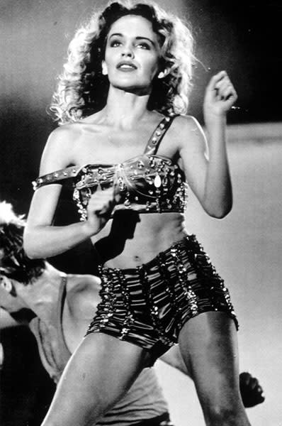 <b>Kylie performing in Tokyo, 1985</b><br><br>The singer wowed the crowds in Japan in this embellished hotpants and bralet combo, predicting the trend way back in the 80s.