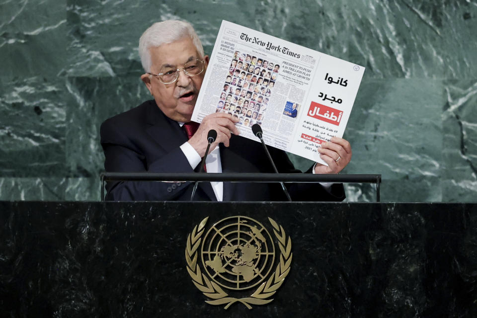 Palestinian President Mahmoud Abbas holds up a graphic showing the May 28, 2021 front page of The New York Times while addressing the 77th session of the United Nations General Assembly, Friday, Sept. 23, 2022, at the U.N. headquarters. (AP Photo/Julia Nikhinson)