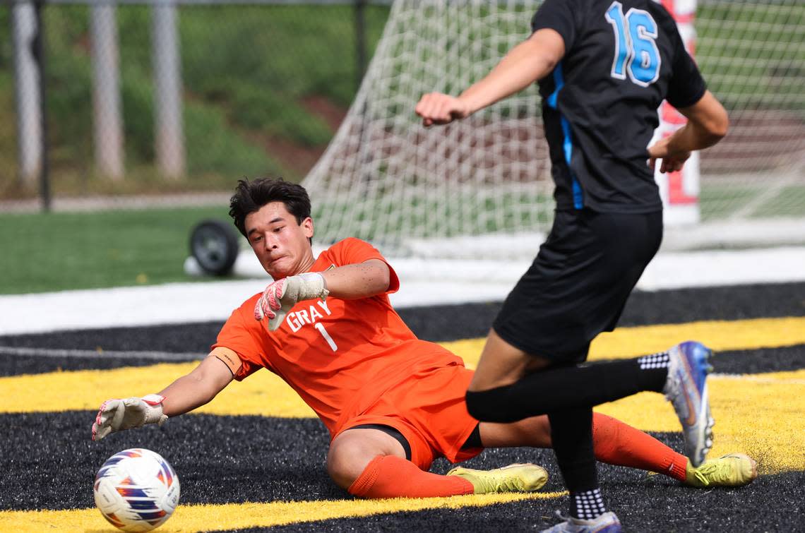 Joey Sullivan (1) of Gray Collegiate saves the shot from Gavin Bauer (16) of Oceanside Collegiate during the SCHSL Class 2A Boys State Soccer Championship between Oceanside Collegiate and Gray Collegiate at Irmo High School on Saturday, May 13, 2023.