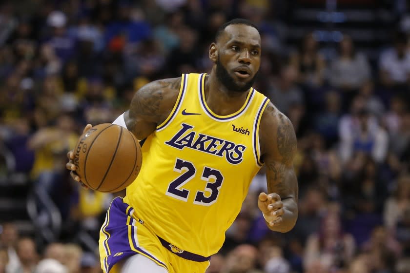 Los Angeles Lakers forward LeBron James controls the ball in the second half against the Phoenix Suns in Phoenix on March 2.
