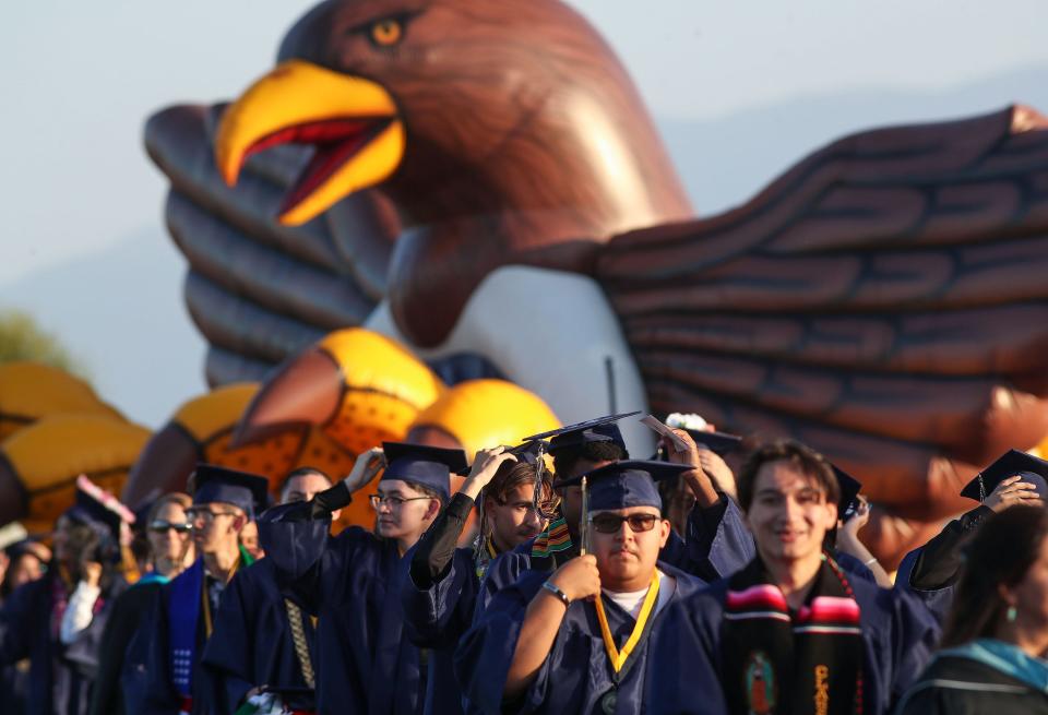 Graduating Desert Hot Springs seniors make their way to the ceremony during the graduation procession in Desert Hot Springs, Calif., June 2, 2023. 